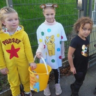 Photo of children collecting money for CIN
