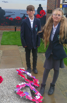Photo of children laying wreaths