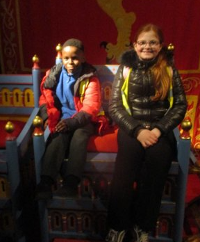 Photo of children sitting on throne at Dover Castle