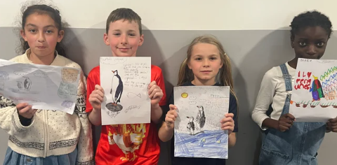 Photo of children showing Endangered Species Day learning