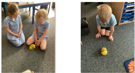 Photos of children using Bee-Bots