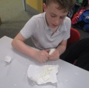 Photo of child making Stone Age Tools