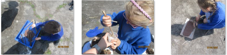 Photos of children building Neolithic houses