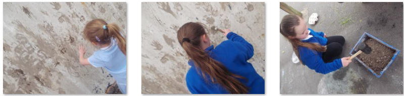 Photos of children trying Stone Age cave painting