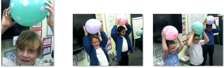 Photo of children experimenting with static electricity and balloons