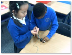 Photo of children experimenting with circuits