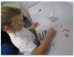 Photos of children making mosaics