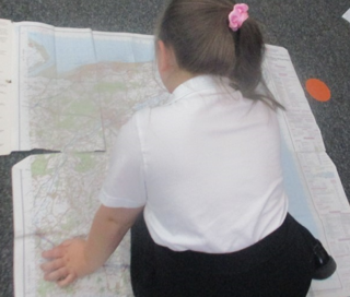 Photo of children using maps