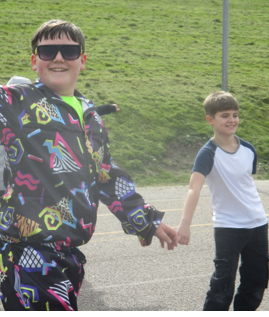 Photo of children dressed up and dancing for Red Nose Day