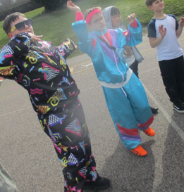 Photo of children dressed up and dancing for Red Nose Day