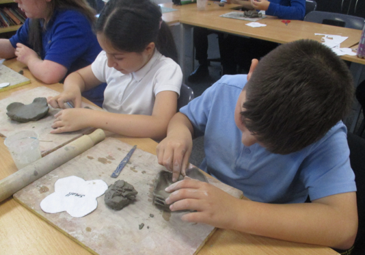 Photos of children making poppies