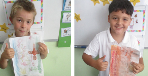 Photos of children holding up Roman art