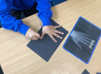 Photo of child drawing x-rays