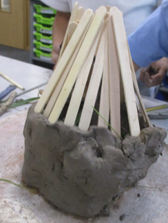 Photos of children building Stone-Age houses