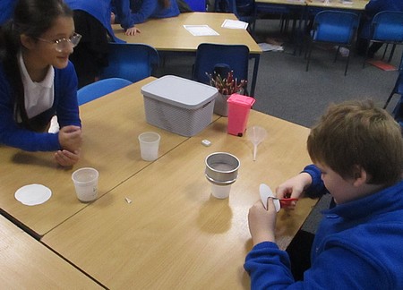Photo of children experimenting with solutions